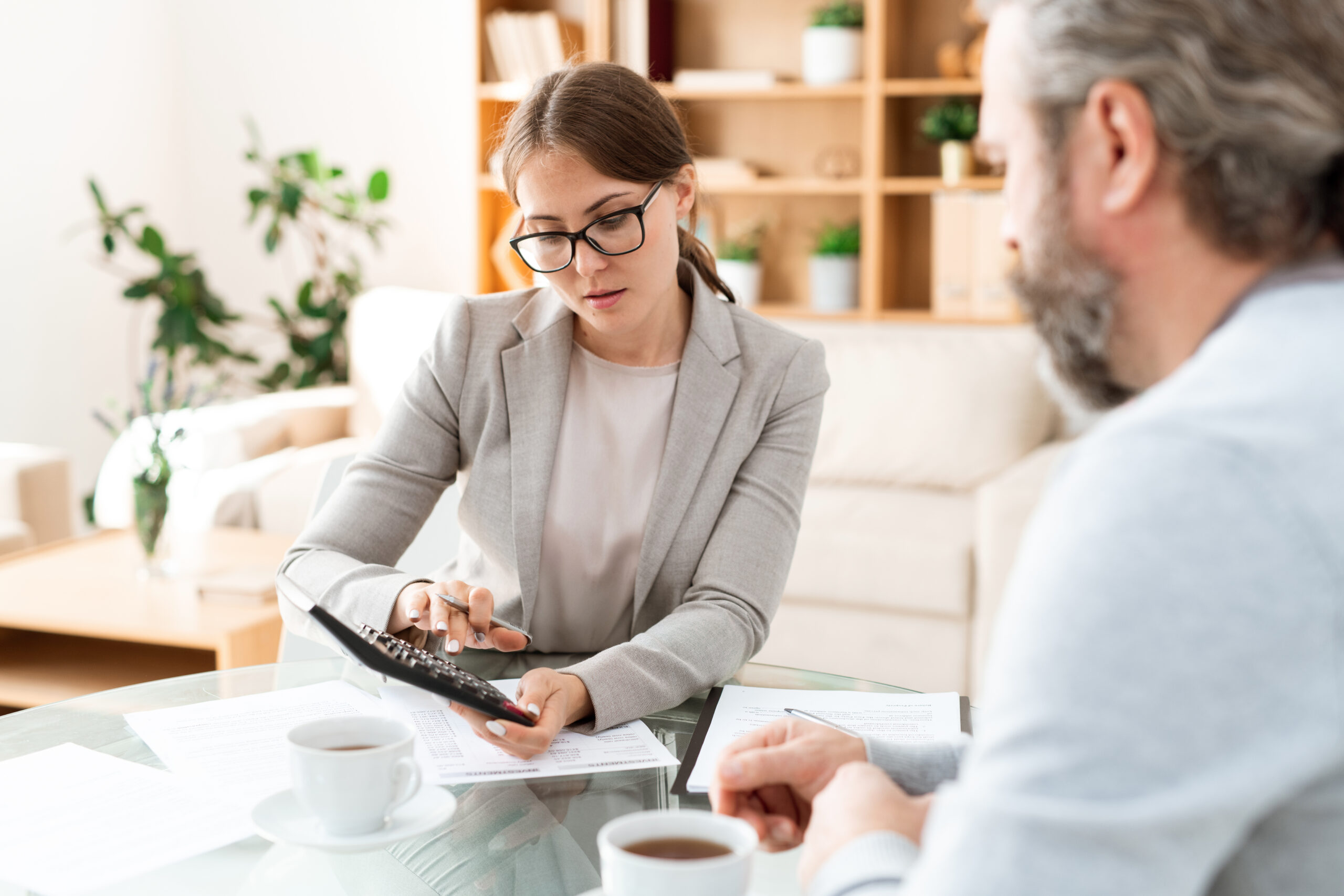 Small business owner discussing finances with an accountant.